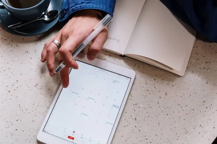 woman on ipad using booking automation